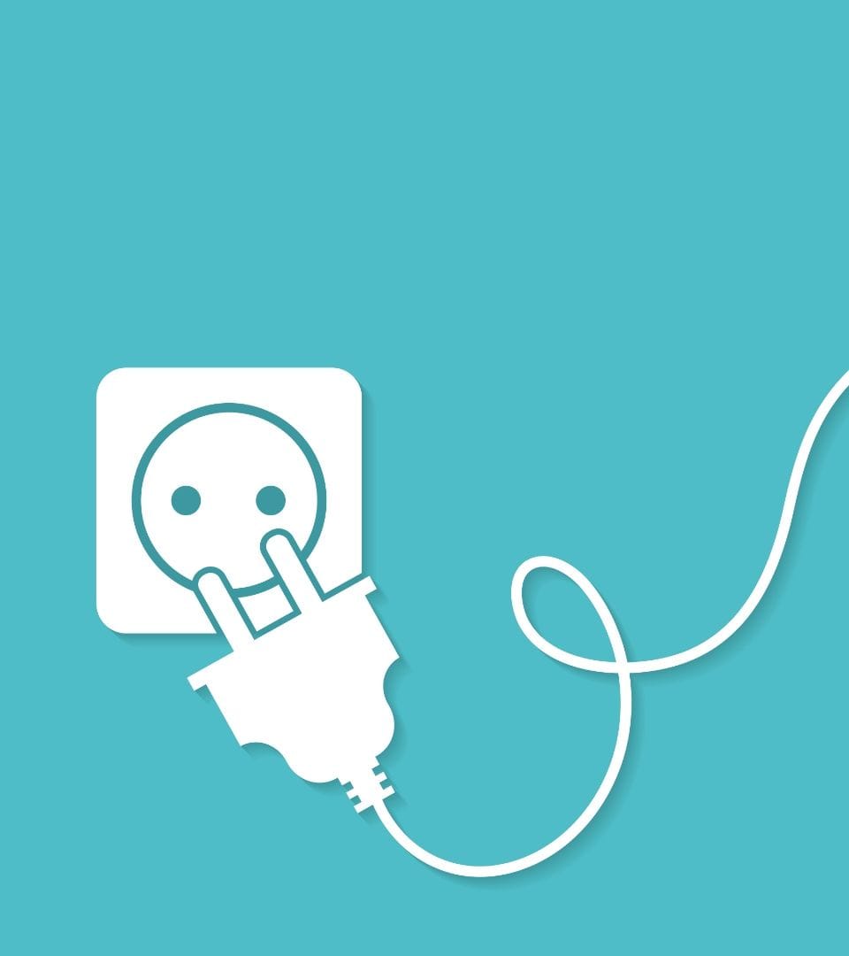 white socket with plug on turquoise background